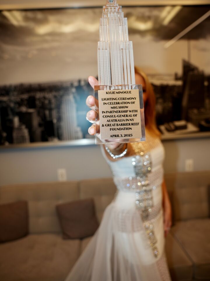 Kylie Minogue holds her ESB model